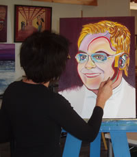 Giselle paints Elton John's Portrait